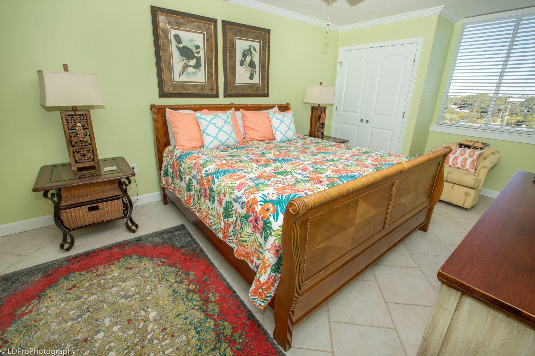 30 Moreno Point Road, Unit 601A Destin, FL 32541 - Photo 28 of 32 a bed room with a bed and a painting on the wall