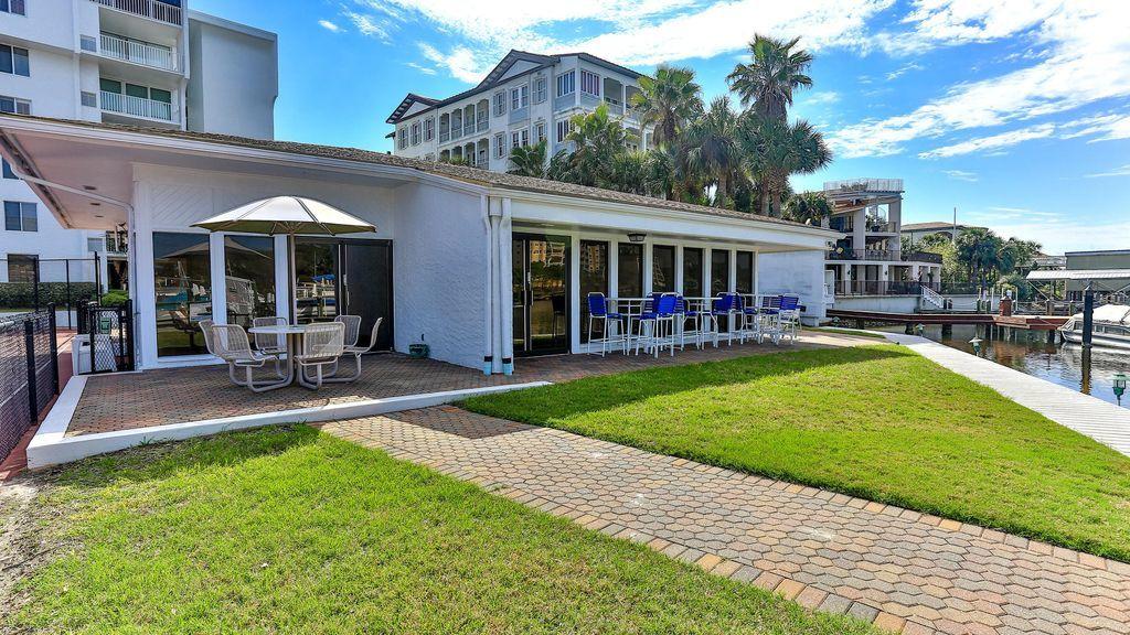 30 Moreno Point Road, Unit 601A Destin, FL 32541 - Photo 32 of 32 a view of a house with backyard porch and sitting area