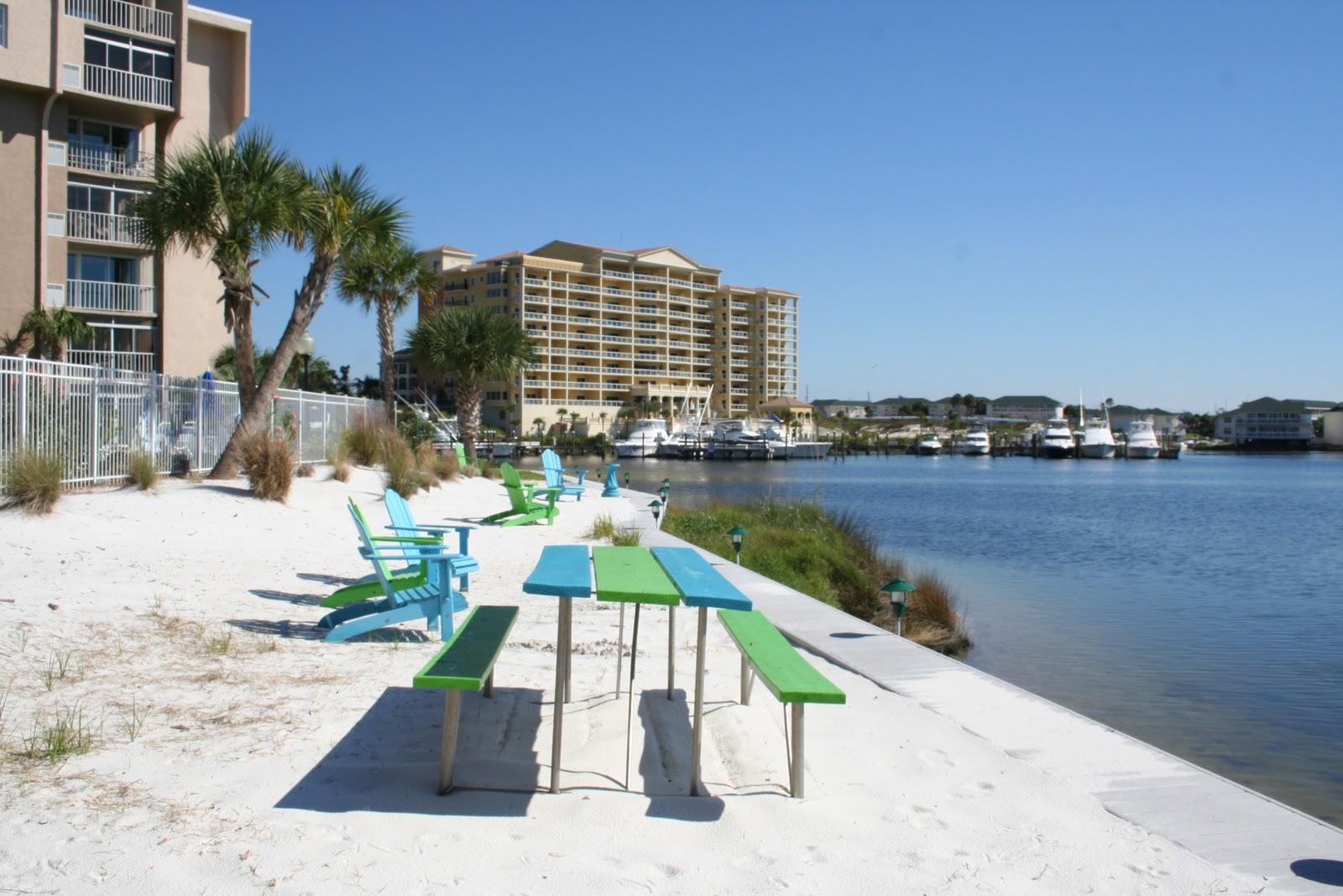 30 Moreno Point Road, Unit 601A Destin, FL 32541 - Photo 6 of 32 a view of swimming pool with outdoor seating and city view
