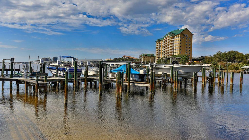 30 Moreno Point Road, Unit 601A Destin, FL 32541 - Photo 10 of 32 a view of a swimming pool with outdoor seating and city view