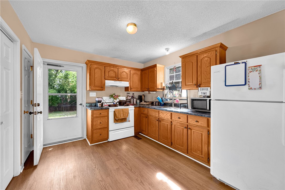 1020 Elizabeth Street Anderson, SC 29624 - Photo 8 of 22 A functional kitchen with wood cabinetry and a clear view to the private yard.