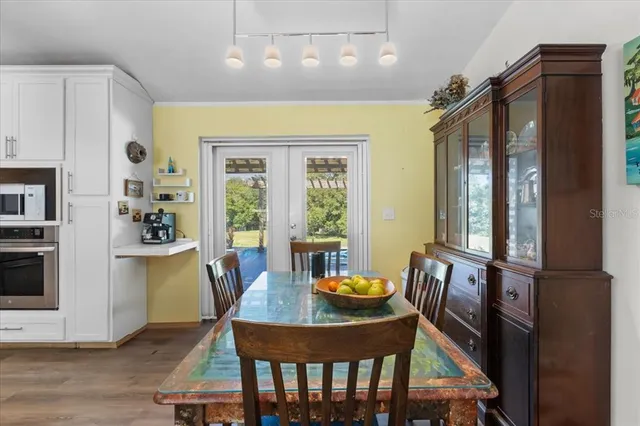 a dining room with furniture and window