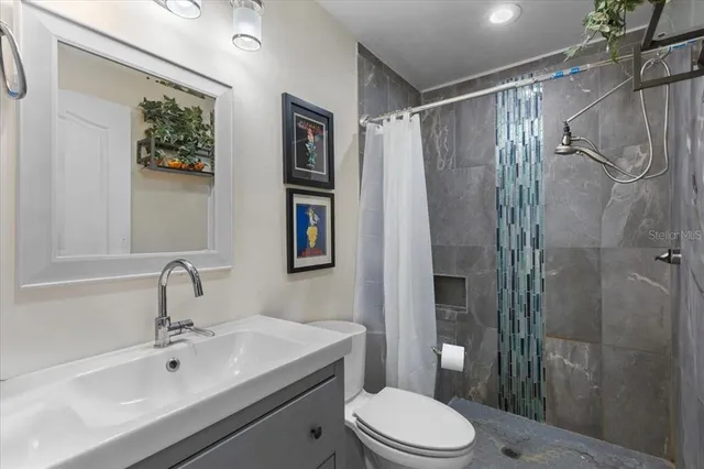 a view of a porch with chairs and backyard