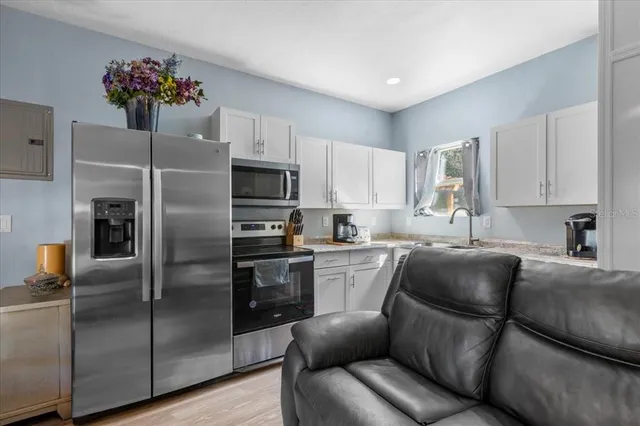 a white toilet sitting next to a bathroom sink
