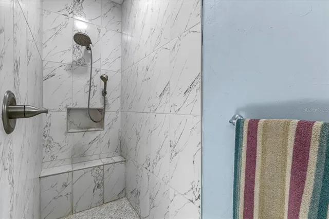 a porch with a table and chairs