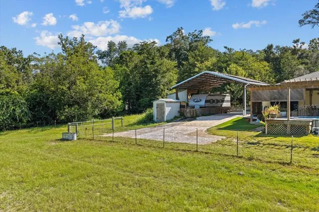 a view of a house with swimming pool