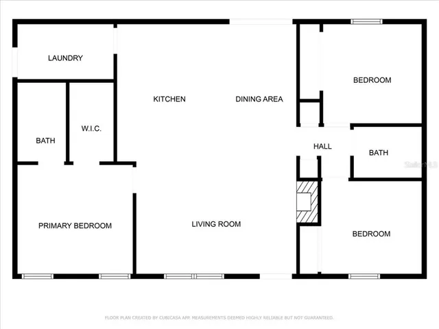 a patio with table and chairs