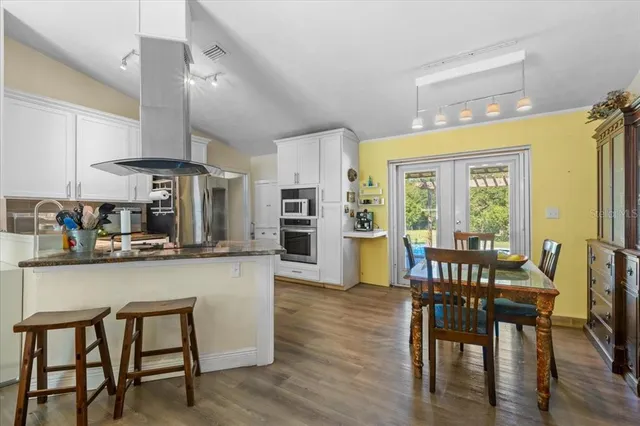 a view of a dining room with furniture window and outside view
