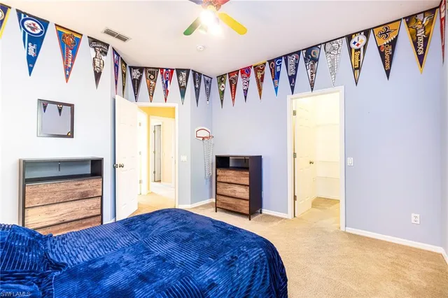 a bedroom with a bed and a walk in closet