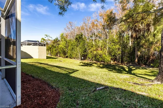 a view of a yard with an outdoor space