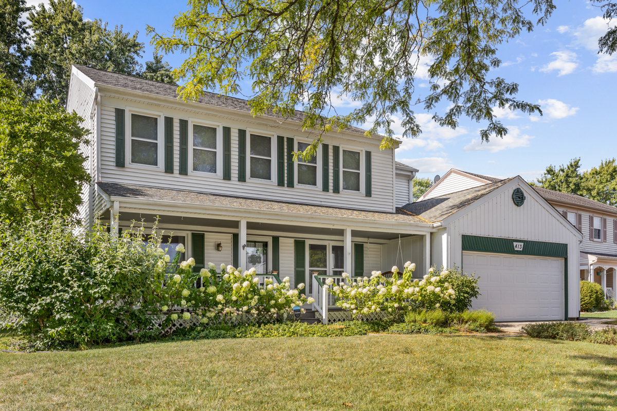 front view of a house with a yard
