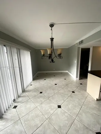 a view of a livingroom with wooden floor