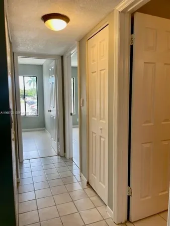 an empty room with a wooden door