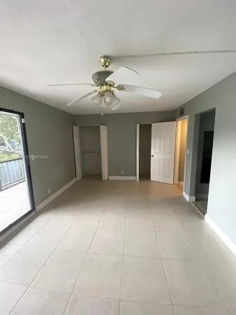 a bathroom with a sink mirror vanity and toilet