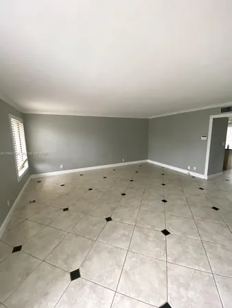 a bathroom with a sink mirror and toilet
