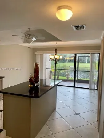 a view of a room with a large window