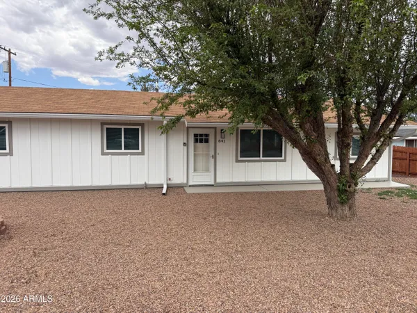 a house with trees in front of it