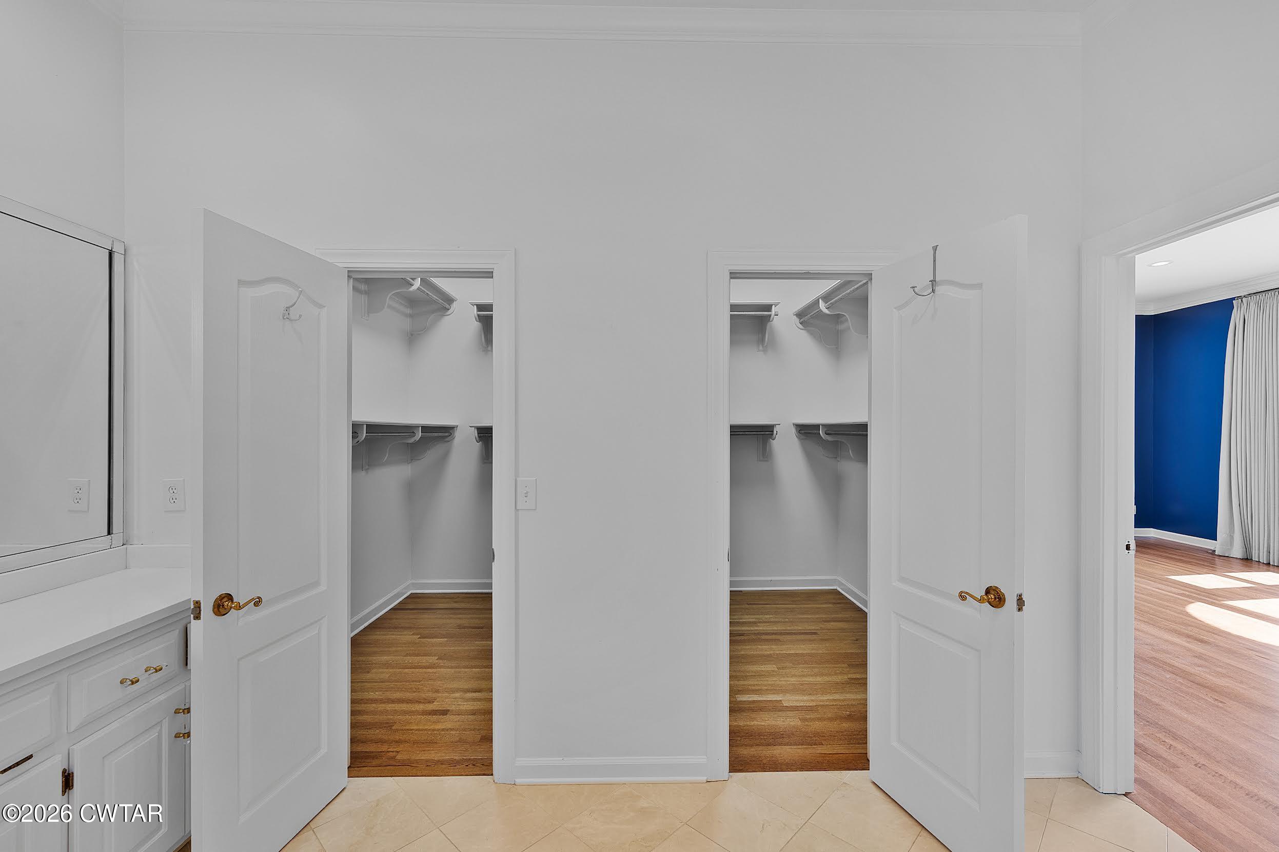 58 Huntington Place Jackson, TN 38305 - Photo 36 of 38 a view of hallway with walk in closet and wooden floor