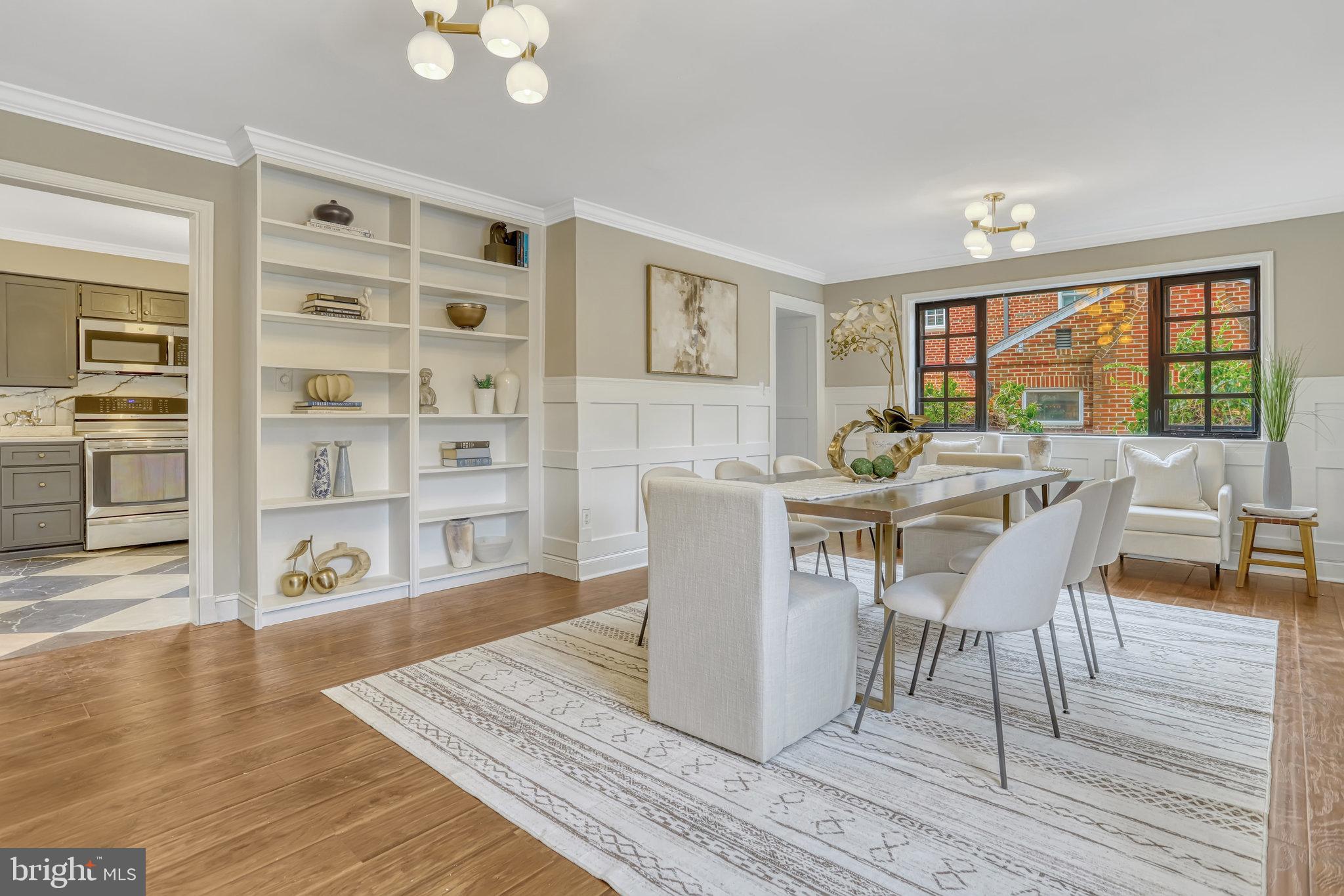 826 West Braddock Road Alexandria, VA 22302 - Photo 1 of 56 a dining room with wooden floor a chandelier a glass table and chairs
