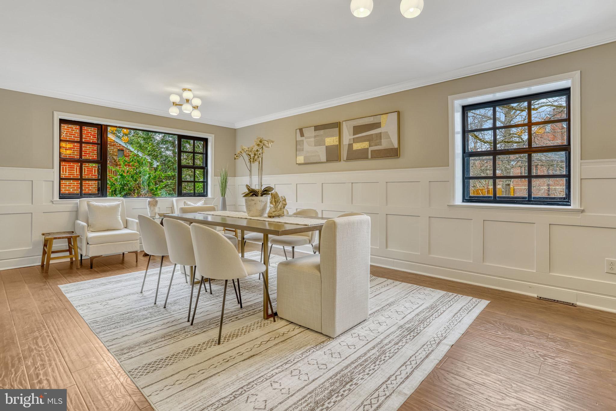 826 West Braddock Road Alexandria, VA 22302 - Photo 11 of 56 a dining room with wooden floor a glass table and windows