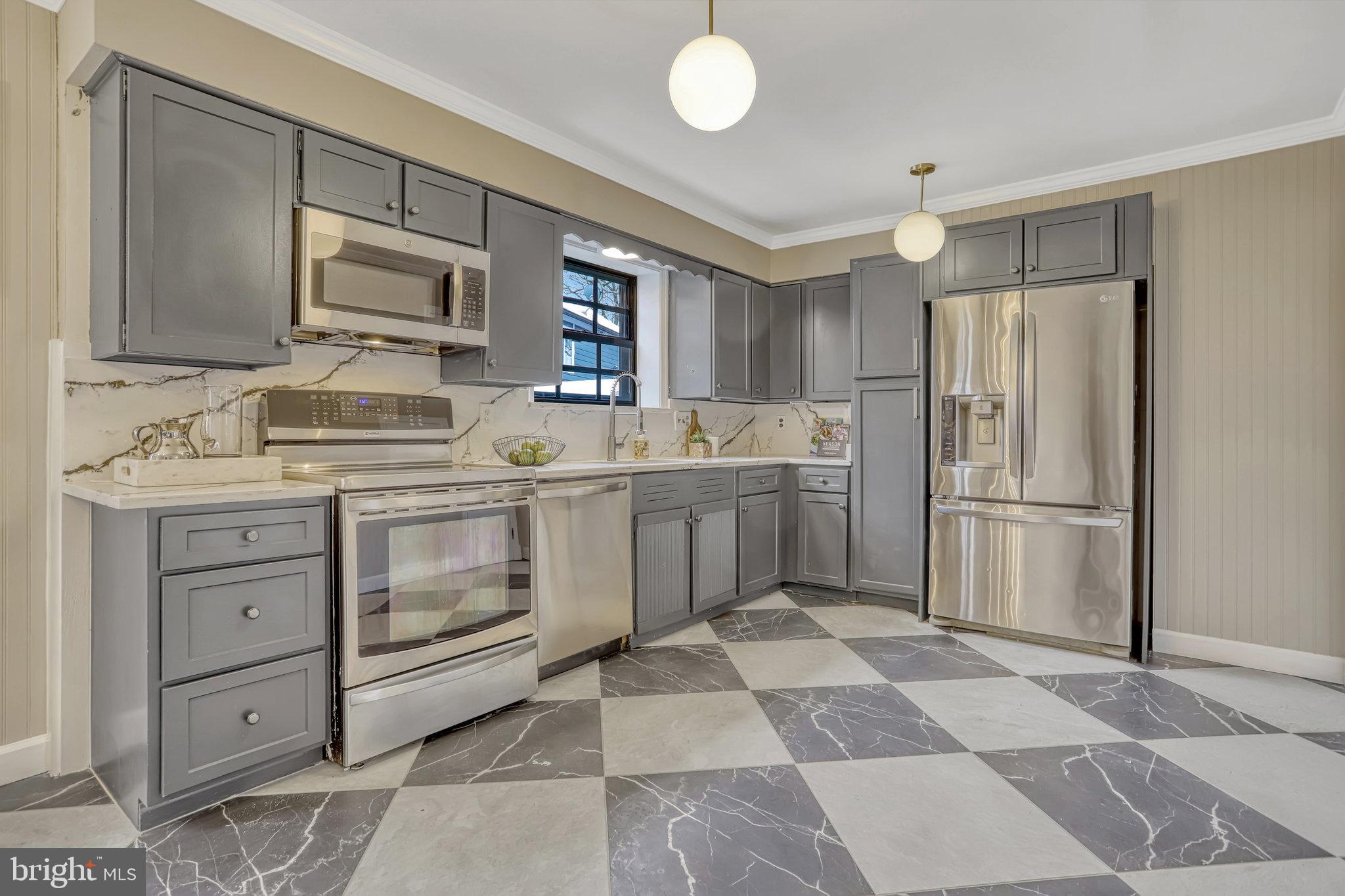 826 West Braddock Road Alexandria, VA 22302 - Photo 14 of 56 a kitchen with a sink stove and refrigerator