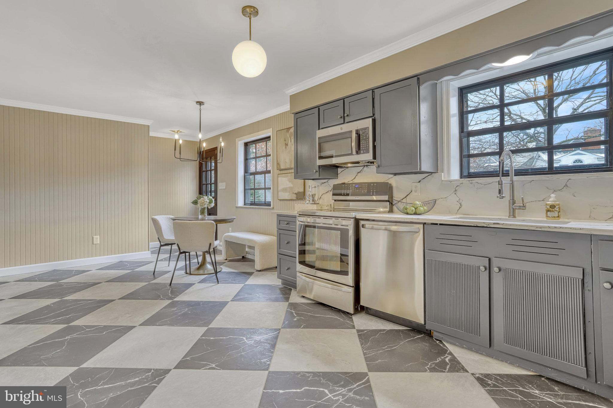 826 West Braddock Road Alexandria, VA 22302 - Photo 15 of 56 a kitchen with a sink cabinets and window