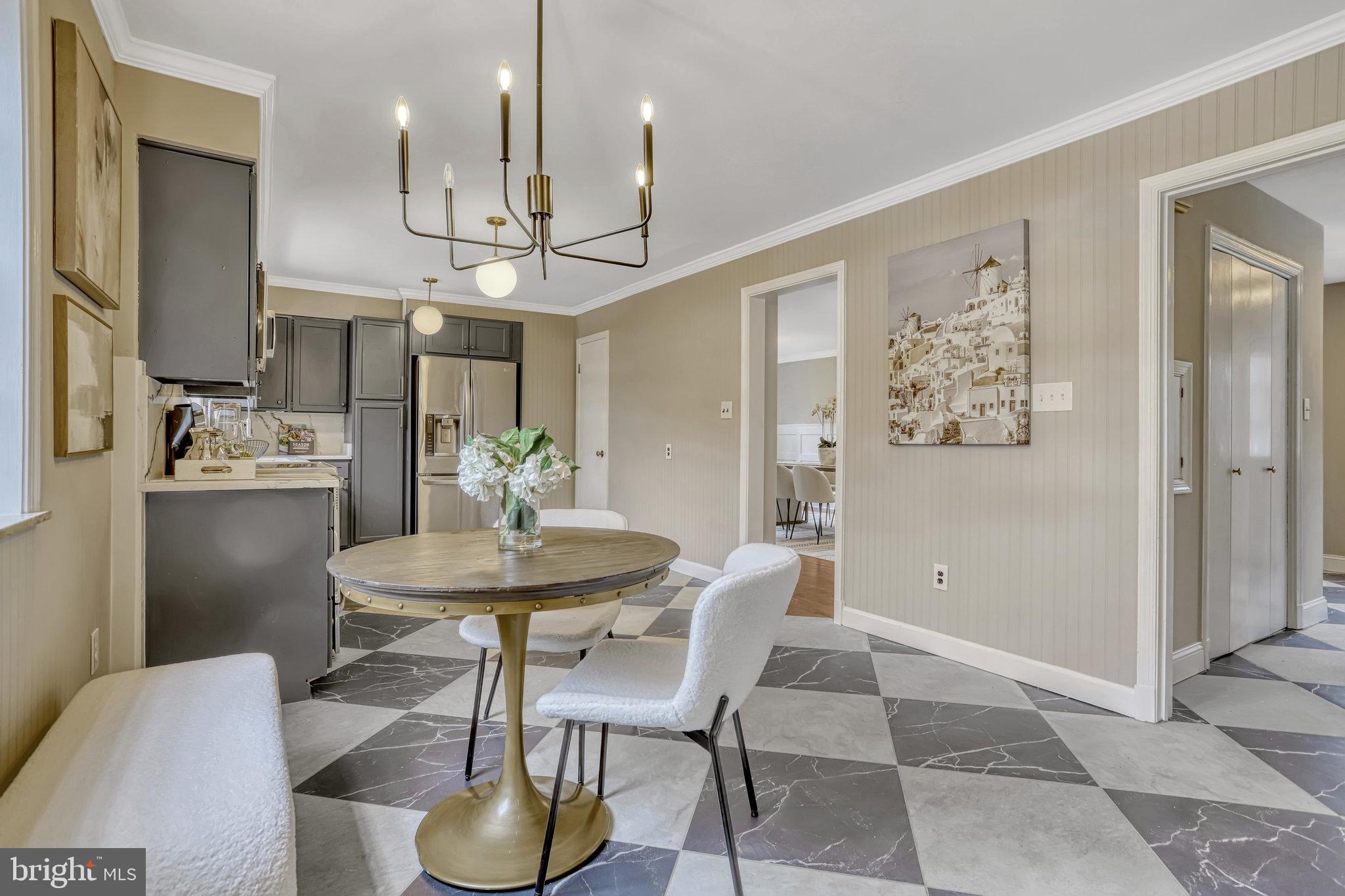 826 West Braddock Road Alexandria, VA 22302 - Photo 16 of 56 a view of a dining room with furniture and a chandelier