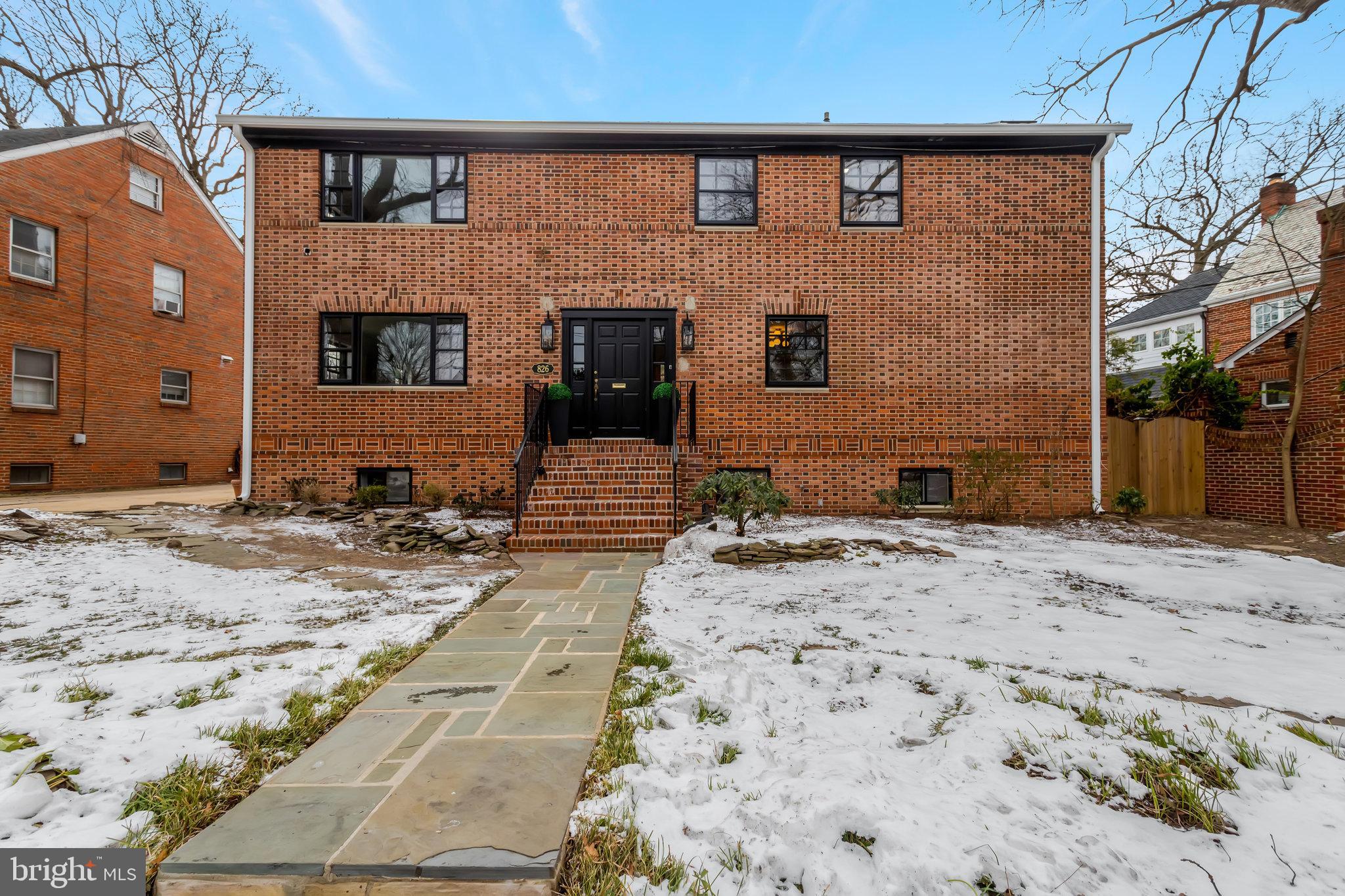 826 West Braddock Road Alexandria, VA 22302 - Photo 2 of 56 a front view of a house with a yard