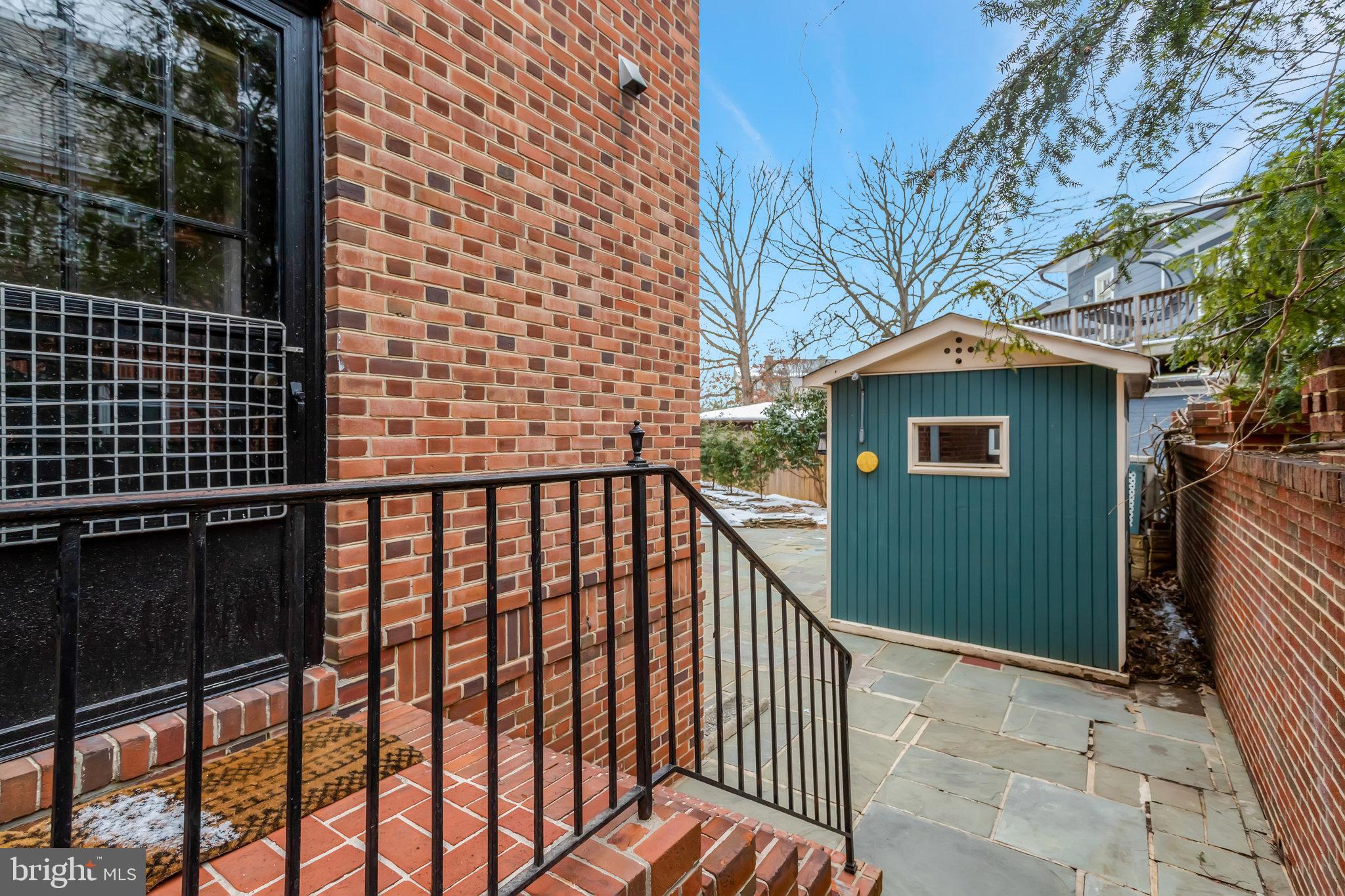 826 West Braddock Road Alexandria, VA 22302 - Photo 20 of 56 a view of a brick house with a large window
