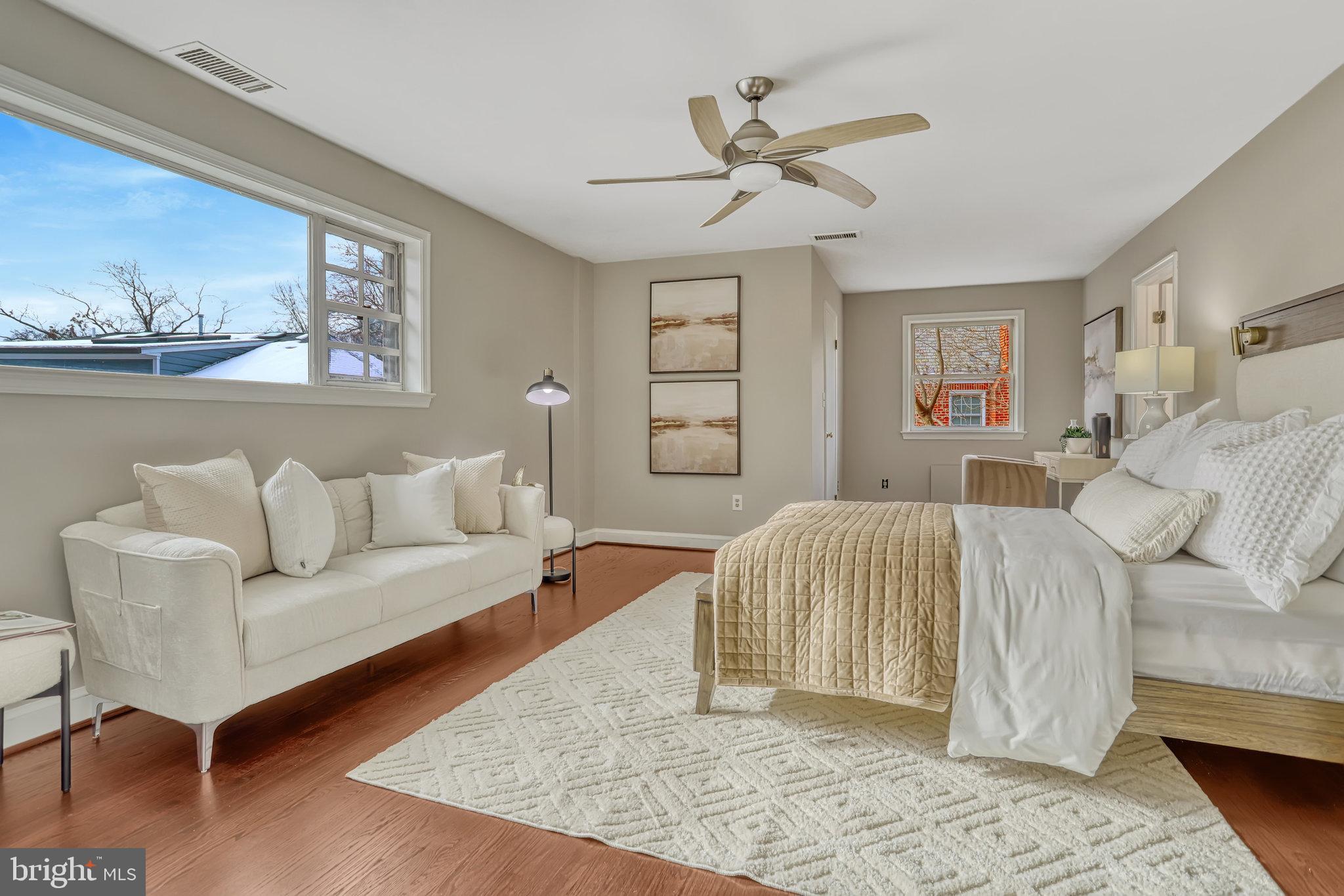 826 West Braddock Road Alexandria, VA 22302 - Photo 27 of 56 a spacious bedroom with a bed a couch and dresser