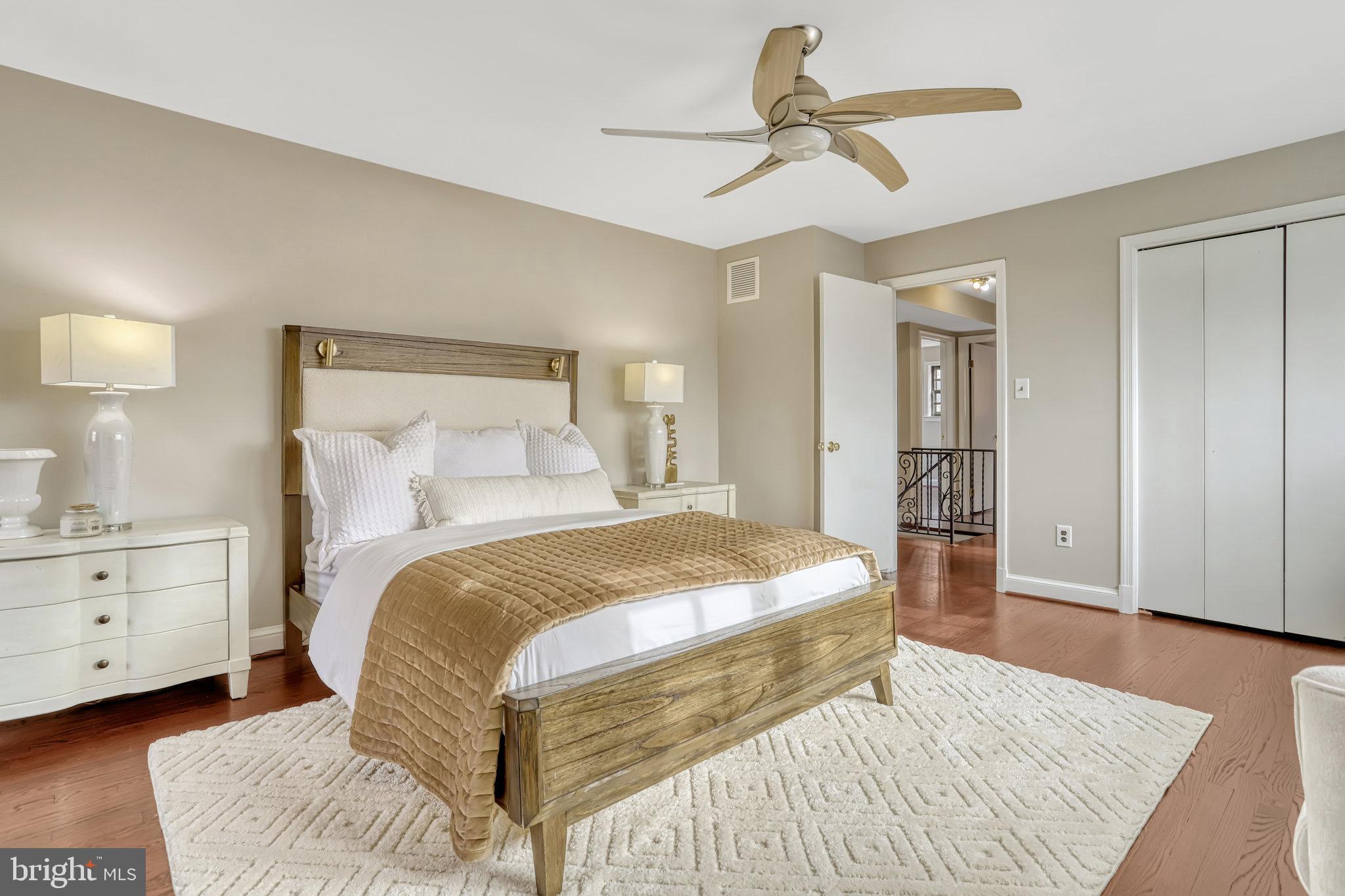 826 West Braddock Road Alexandria, VA 22302 - Photo 28 of 56 a bedroom with a bed and wooden floor