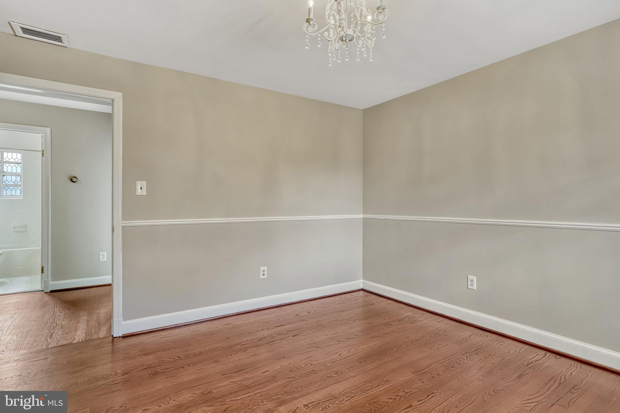 826 West Braddock Road Alexandria, VA 22302 - Photo 34 of 56 an empty room with wooden floor