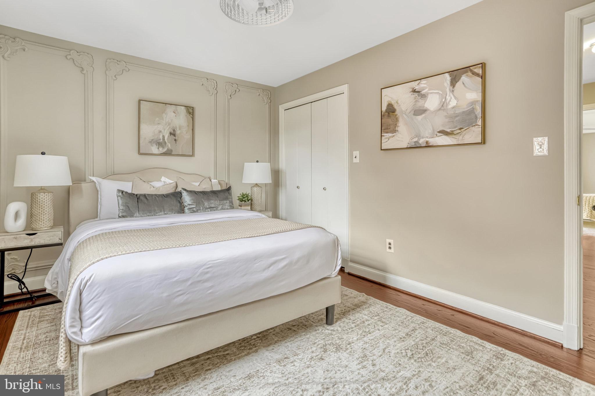 826 West Braddock Road Alexandria, VA 22302 - Photo 42 of 56 a bedroom with a bed and painting on the wall