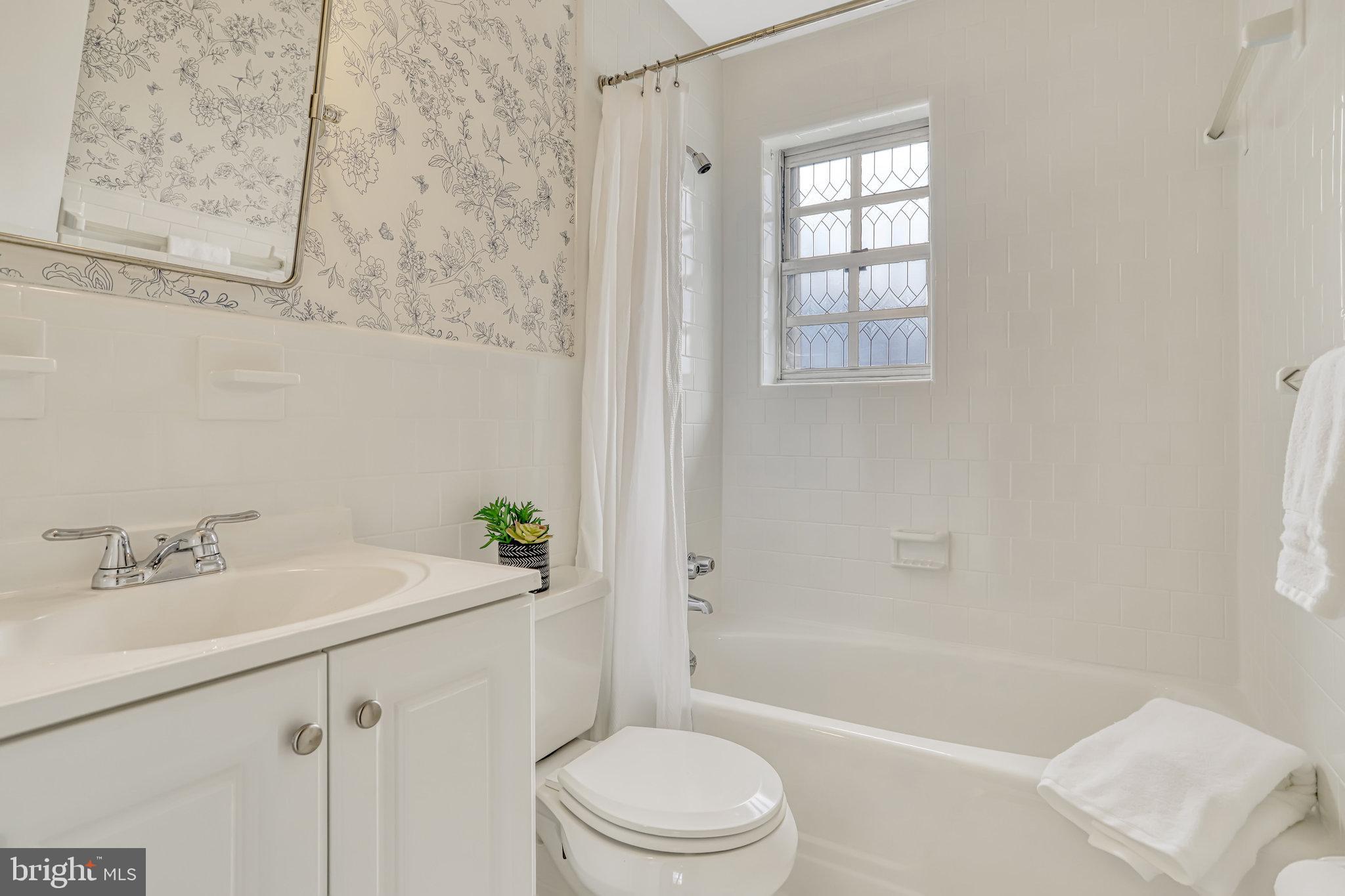 826 West Braddock Road Alexandria, VA 22302 - Photo 43 of 56 a bathroom with a sink toilet and shower