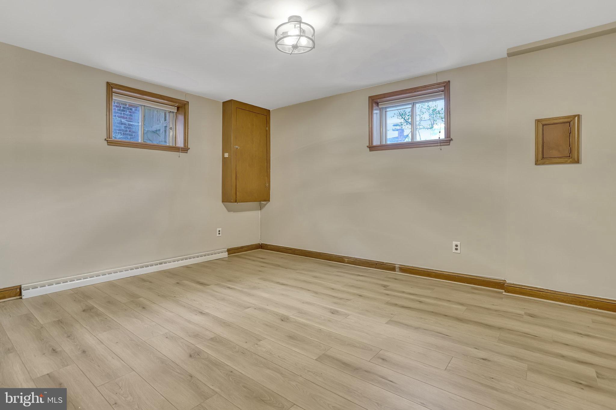 826 West Braddock Road Alexandria, VA 22302 - Photo 47 of 56 a view of an empty room with window and wooden floor