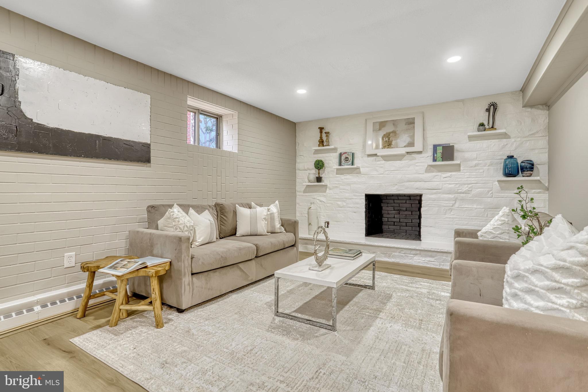 826 West Braddock Road Alexandria, VA 22302 - Photo 49 of 56 a living room with furniture and a fireplace
