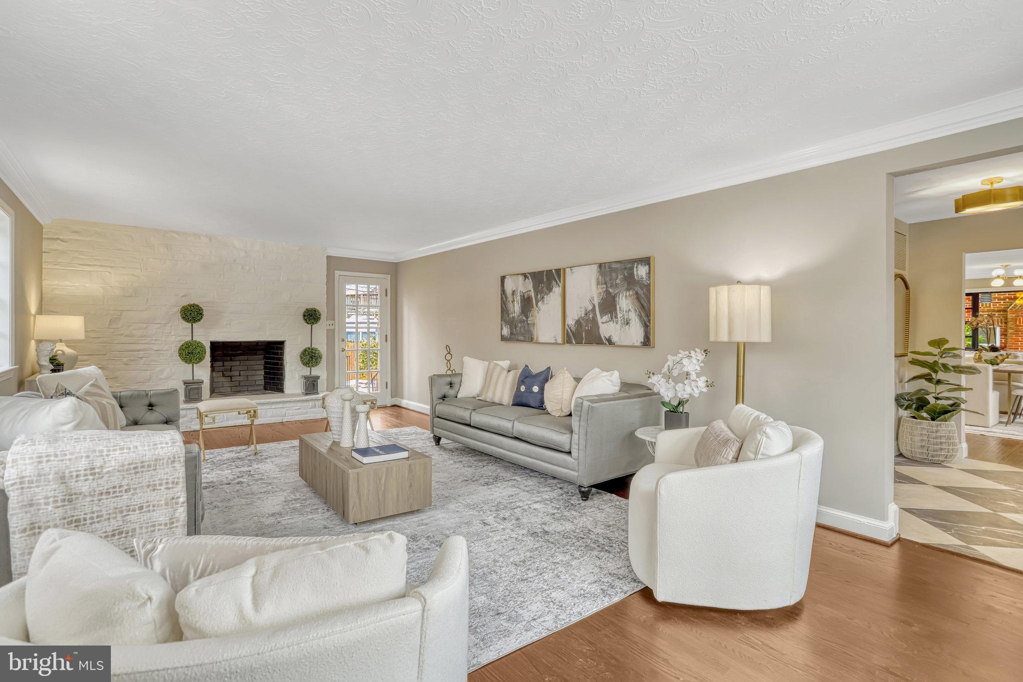 826 West Braddock Road Alexandria, VA 22302 - Photo 5 of 56 a living room with fireplace furniture and wooden floor