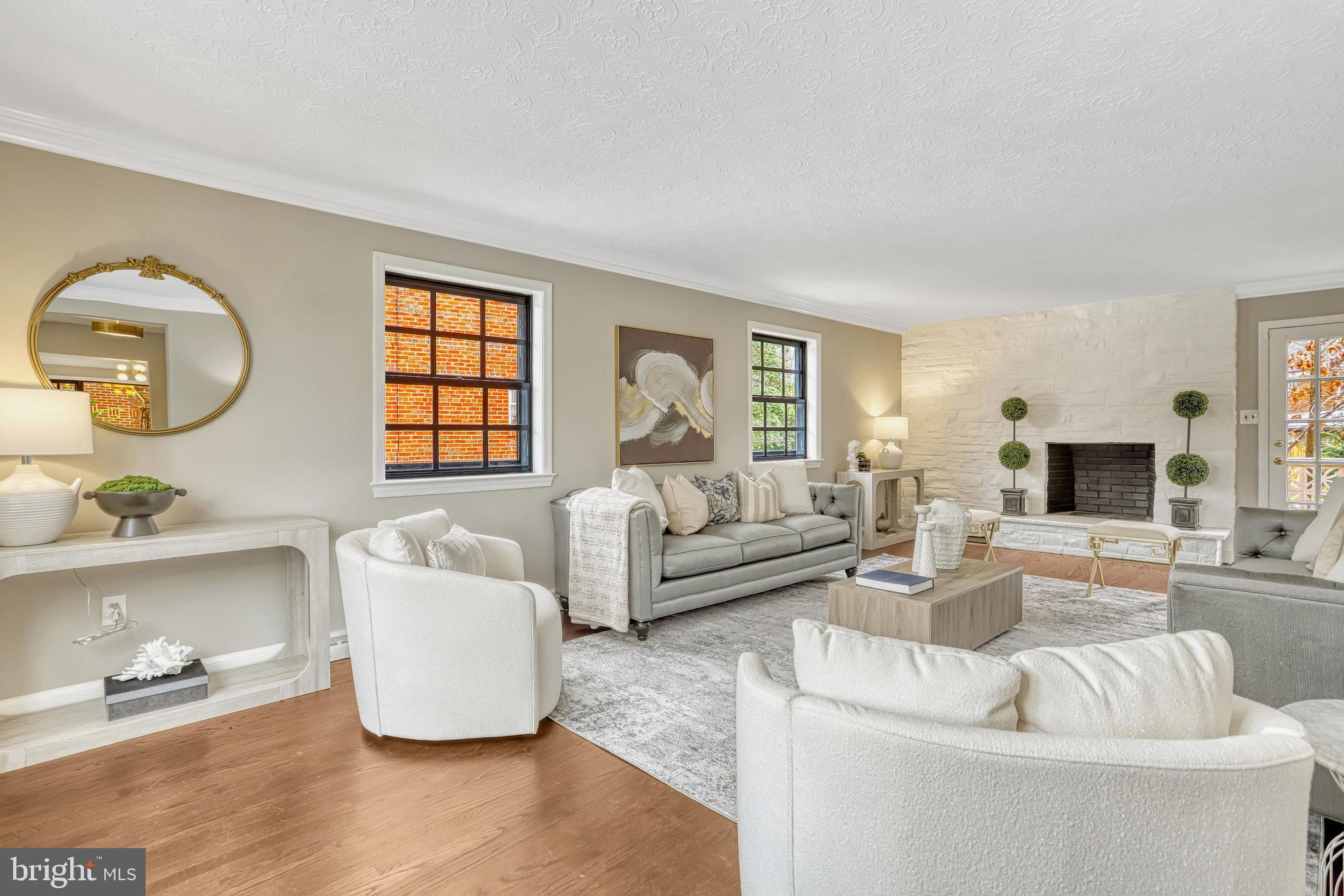 826 West Braddock Road Alexandria, VA 22302 - Photo 7 of 56 a living room with furniture and a fireplace