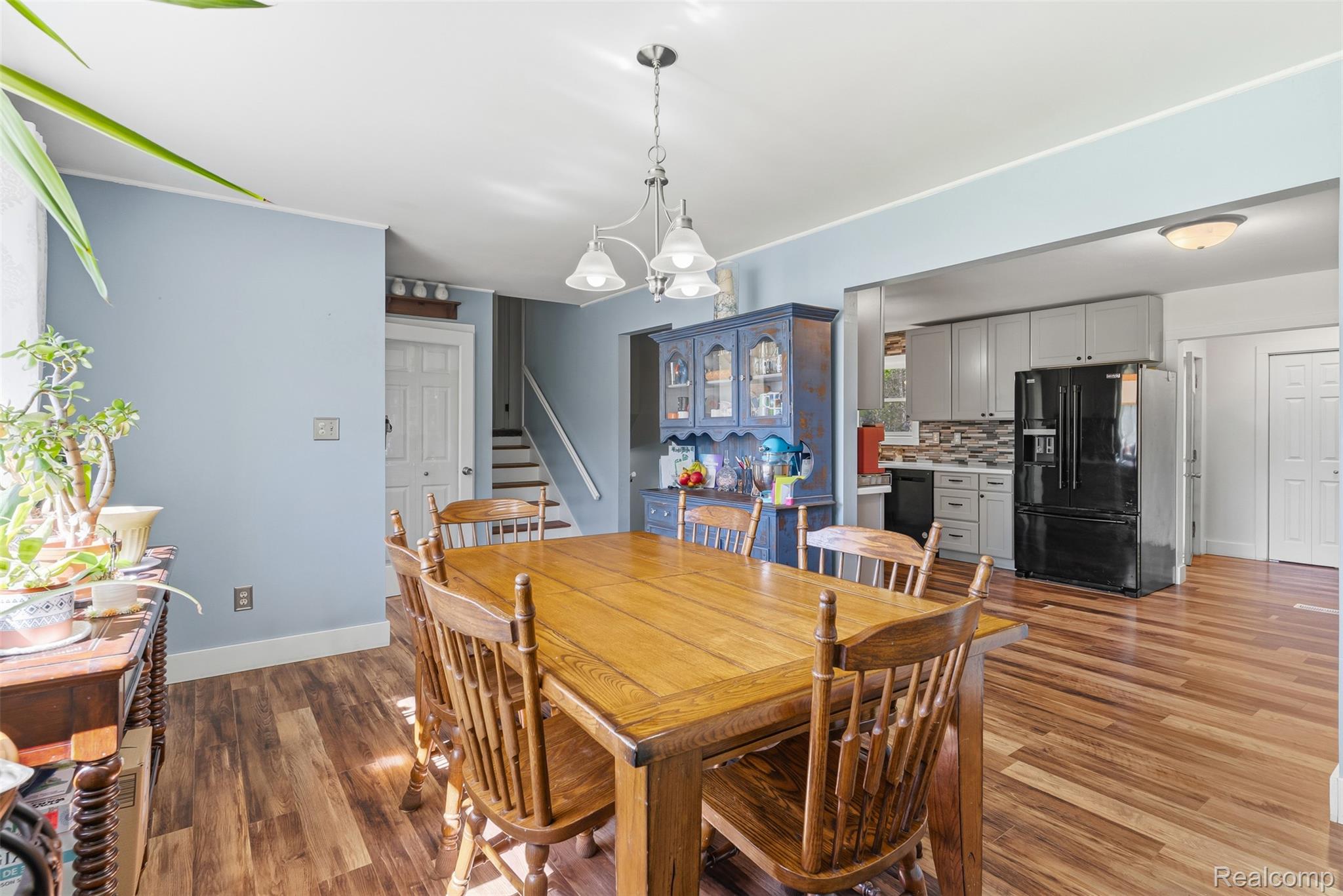14433 Tuscola Road Clio, MI 48420 - Photo 10 of 43 Dining space with light wood-type flooring and suspended lighting