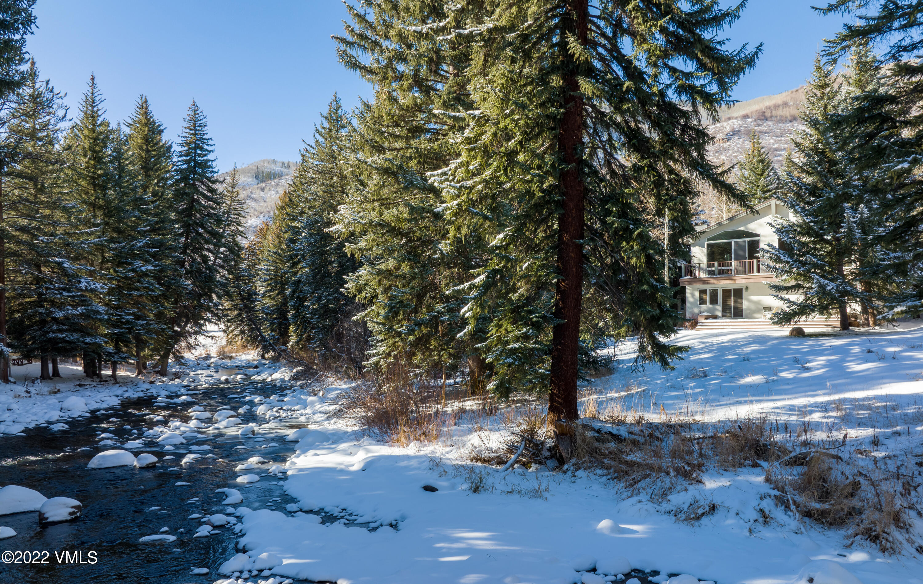 1850 South Frontage Road West, Unit 3 Vail, CO 81657 - Photo 1 of 28 a backyard of a house with lots of green space
