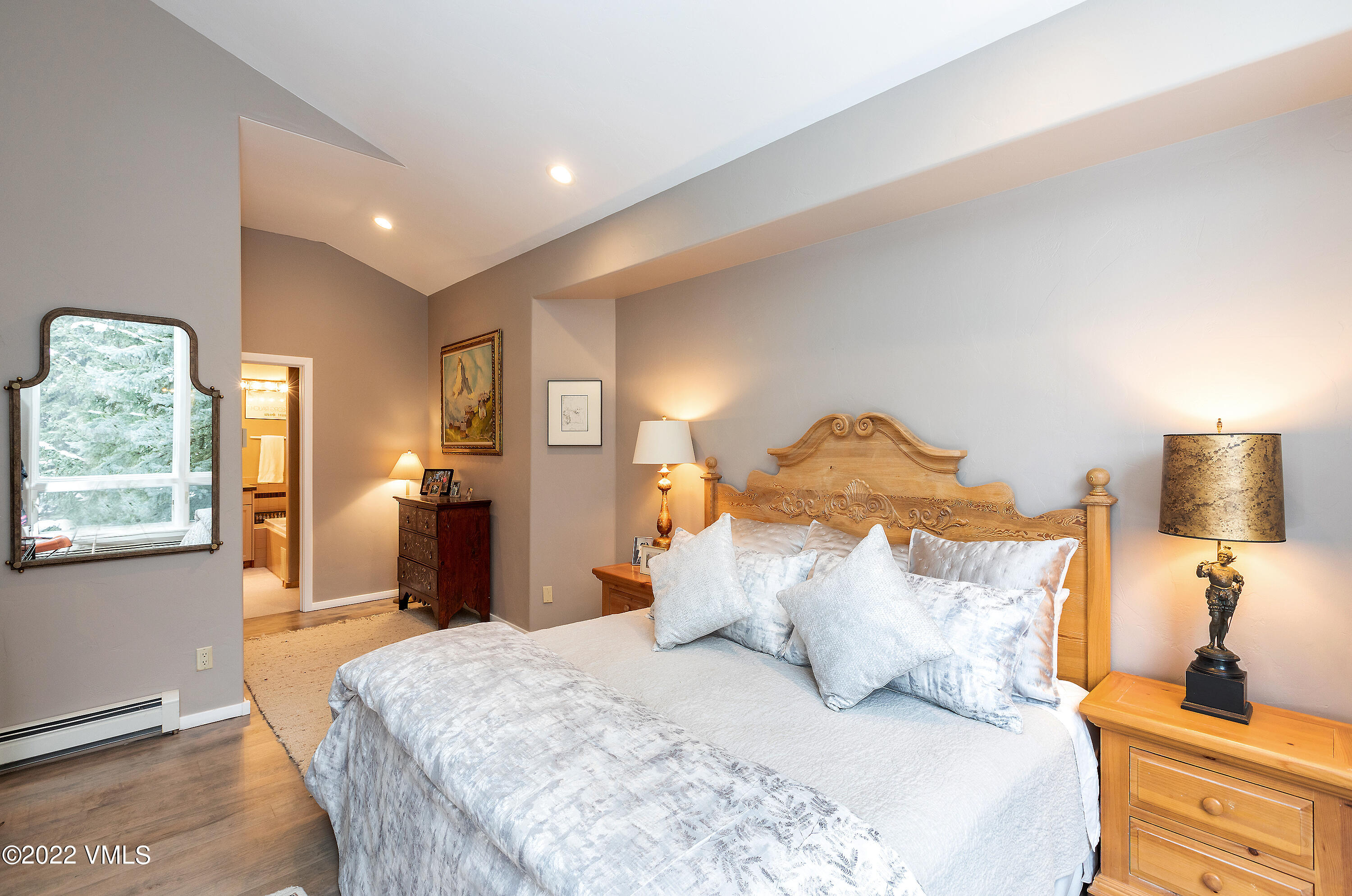 1850 South Frontage Road West, Unit 3 Vail, CO 81657 - Photo 11 of 28 a large bed sitting in a bedroom next to a window