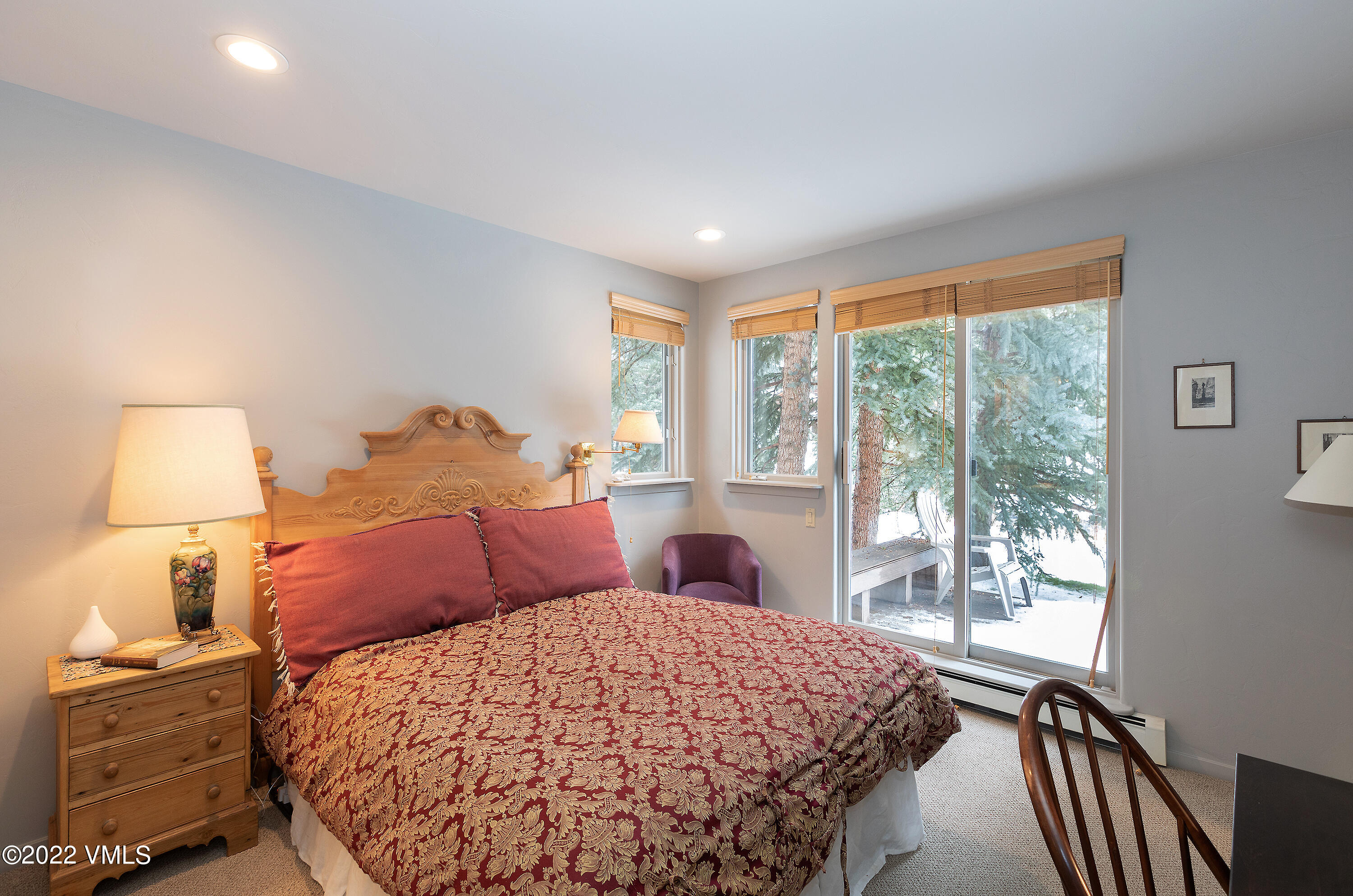 1850 South Frontage Road West, Unit 3 Vail, CO 81657 - Photo 17 of 28 a bedroom with a bed and a lamp