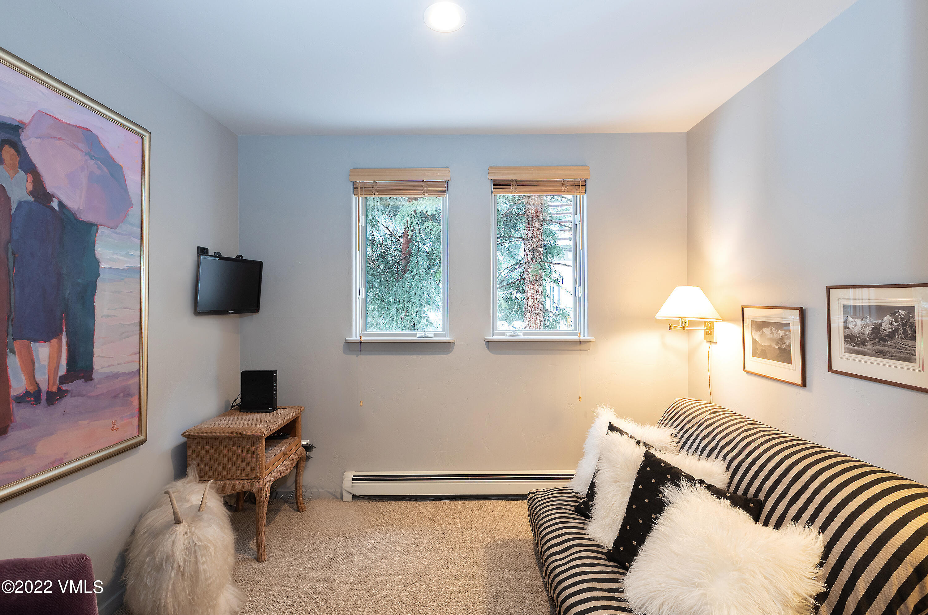 1850 South Frontage Road West, Unit 3 Vail, CO 81657 - Photo 19 of 28 a bedroom with a bed and a flat screen tv