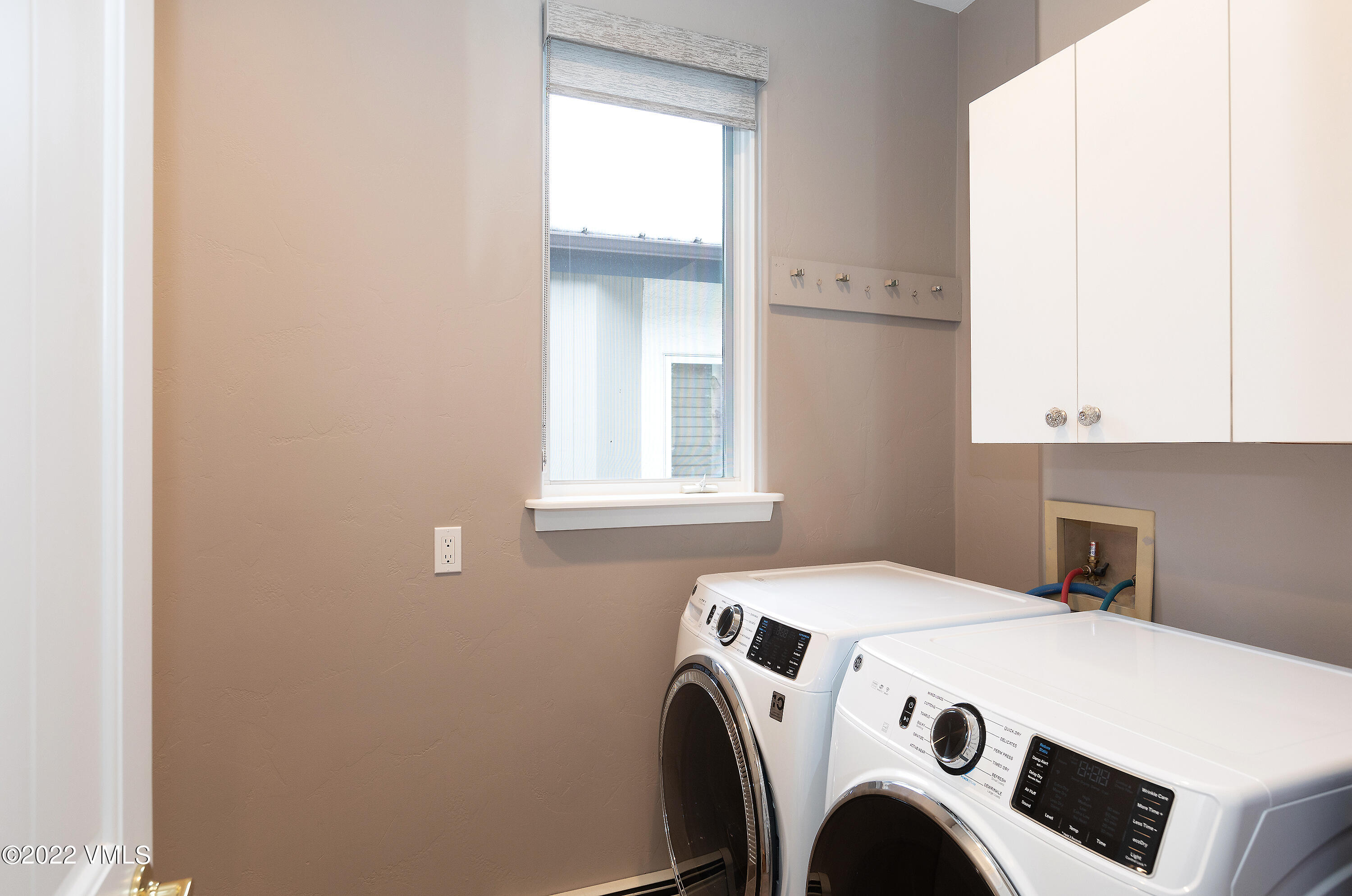 1850 South Frontage Road West, Unit 3 Vail, CO 81657 - Photo 22 of 28 a utility room with dryer and washer