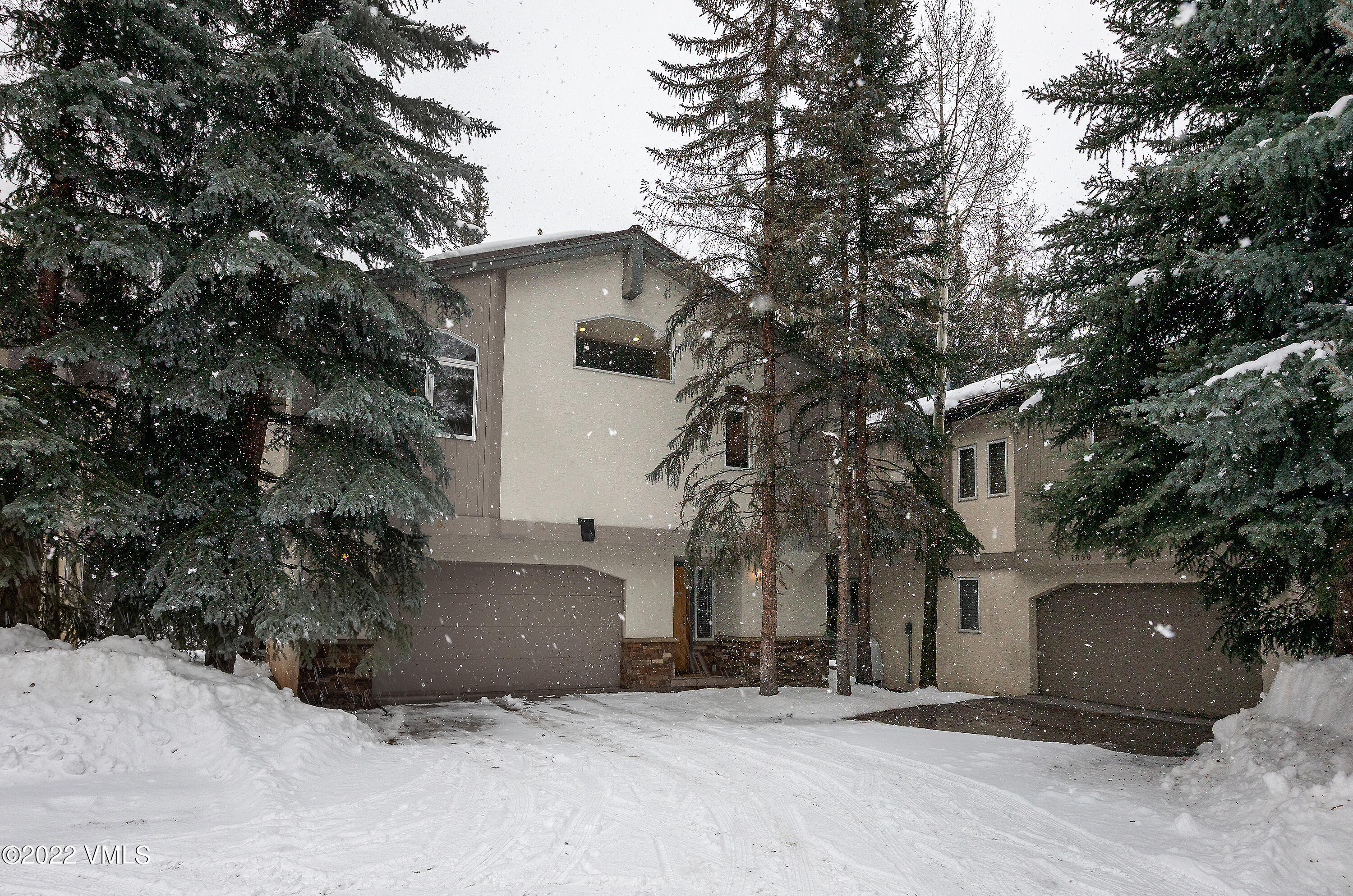 1850 South Frontage Road West, Unit 3 Vail, CO 81657 - Photo 23 of 28 a front view of a house with a tree