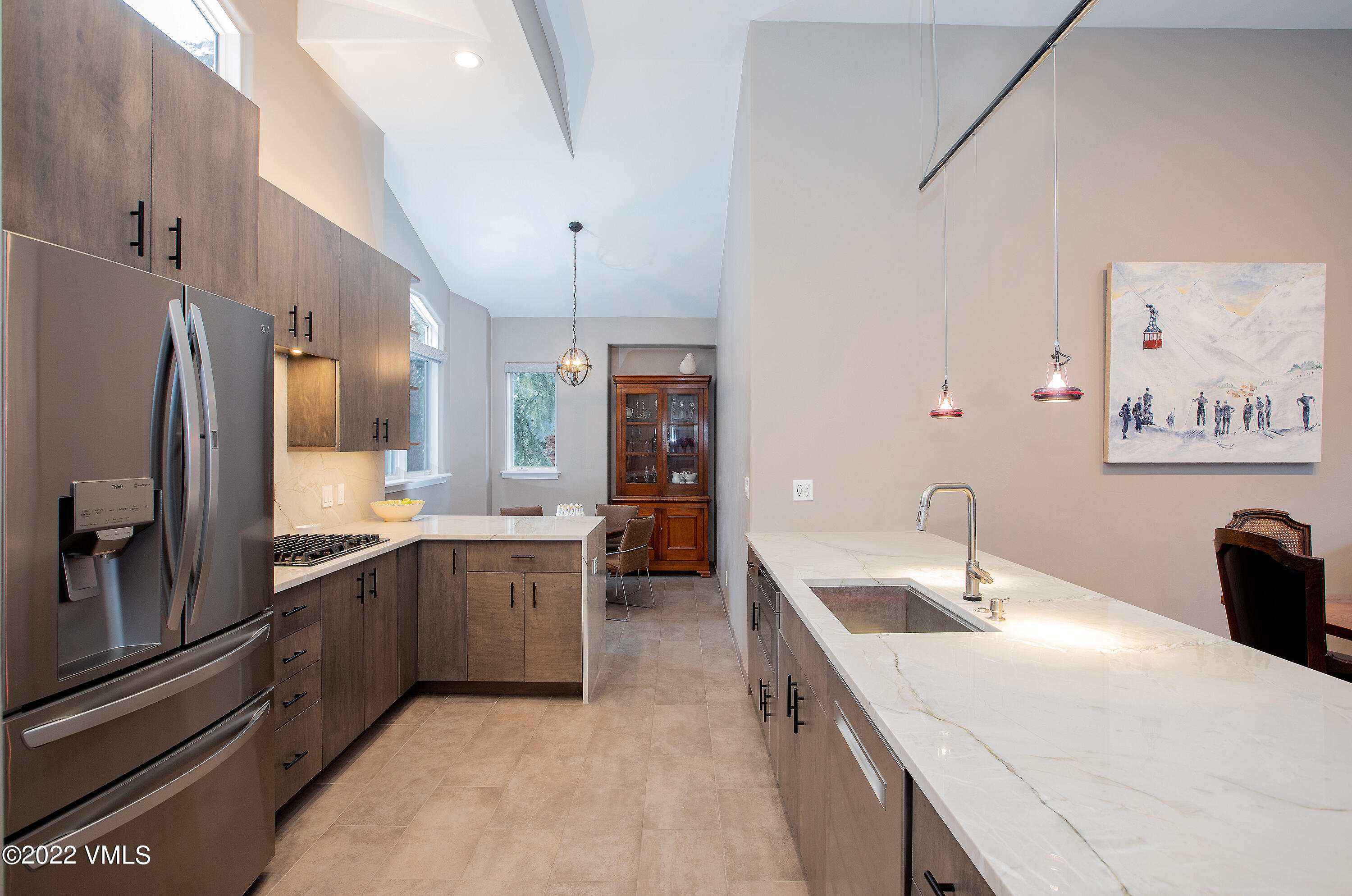 1850 South Frontage Road West, Unit 3 Vail, CO 81657 - Photo 5 of 28 a large kitchen with stainless steel appliances lots of counter space and breakfast area