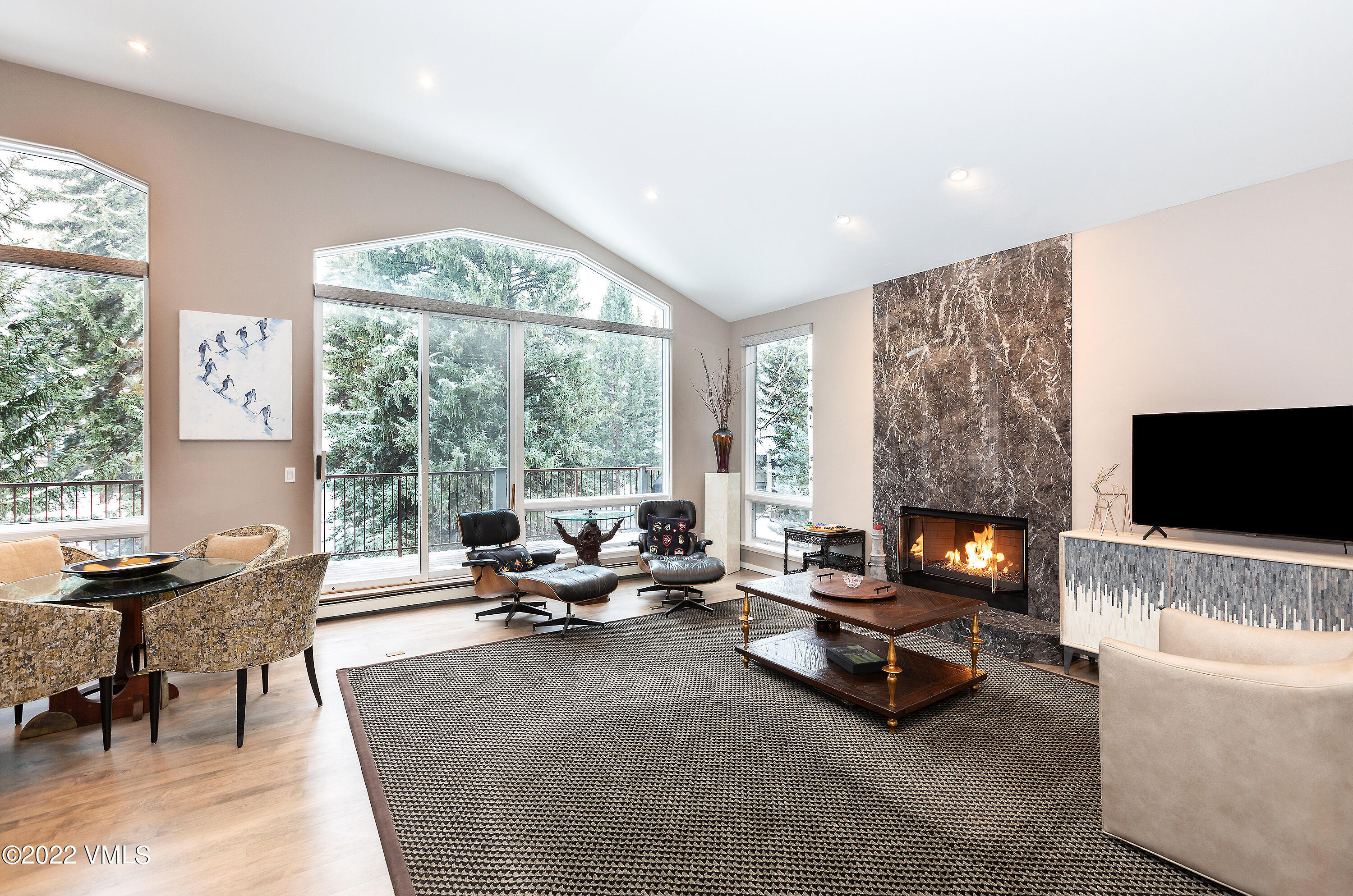 1850 South Frontage Road West, Unit 3 Vail, CO 81657 - Photo 8 of 28 a living room with furniture and a flat screen tv