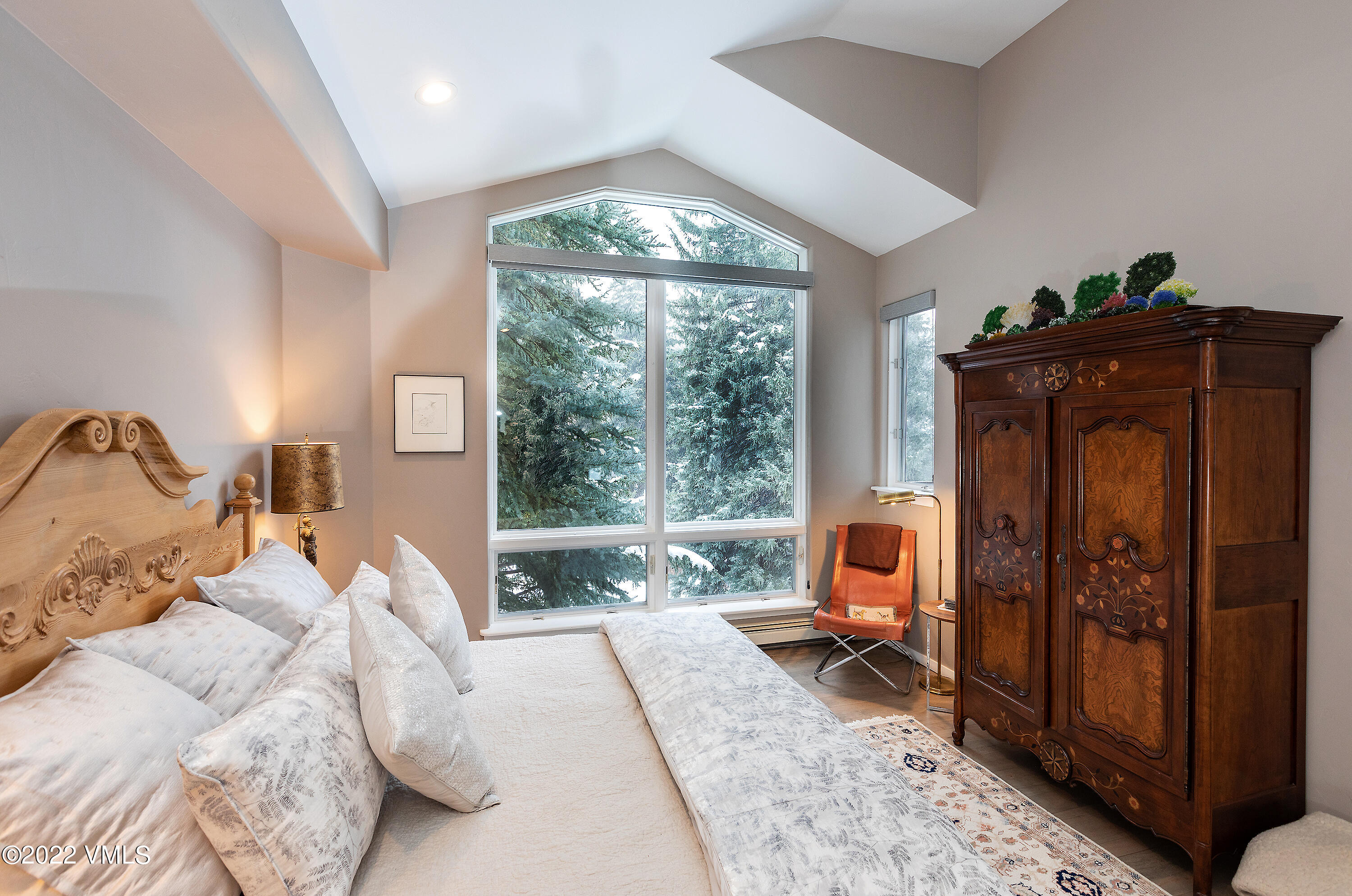 1850 South Frontage Road West, Unit 3 Vail, CO 81657 - Photo 10 of 28 a bedroom with a bed and large windows