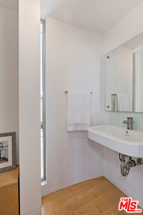 32 Fleet Street Marina del Rey, CA 90292 - Photo 14 of 39 a bathroom with a sink and a mirror