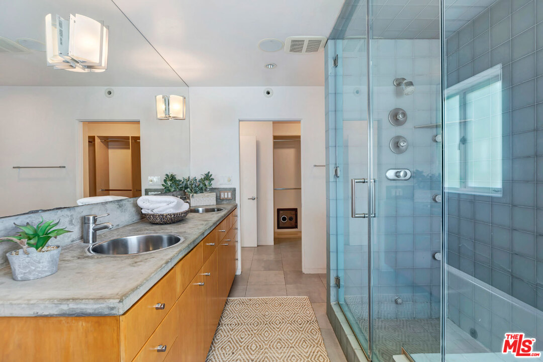 32 Fleet Street Marina del Rey, CA 90292 - Photo 19 of 39 a bathroom with sink shower and mirror